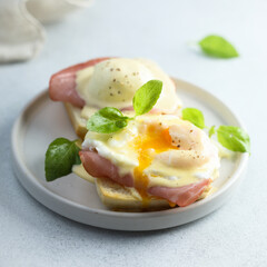 Traditional homemade Benedict eggs with ham