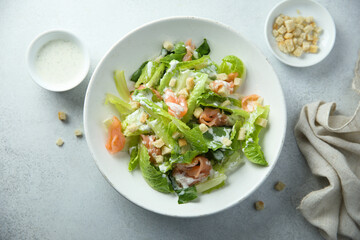 Traditional homemade Caesar salad with smoked salmon