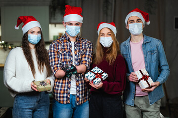 New Year's Eve during the pandemic. Youth party in protective masks. A young man with a disability with amputated hands