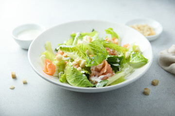 Traditional homemade Caesar salad with smoked salmon