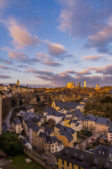 Vertical sunset view of the lower town of Luxembourg City with Kirchberg business district in the background