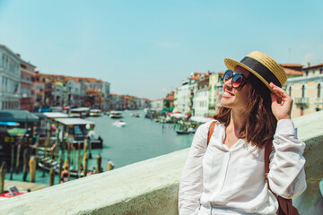 Fototapeta na wymiar woman portrait in sunny summer day grand canal venice italy on background