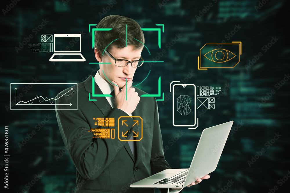 Poster Portrait of attractive thoughtful businessman using laptop with creative face recognition control hologram on dark background. Technology and smart tech concept. Double exposure.