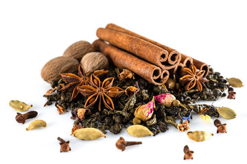 Green large-leaf tea with an anise star. nutmeg. cloves and cinnamon sticks. Macro photography