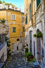 A narrow street among the old houses of Amalfi, a town on the coast of southern Italy.