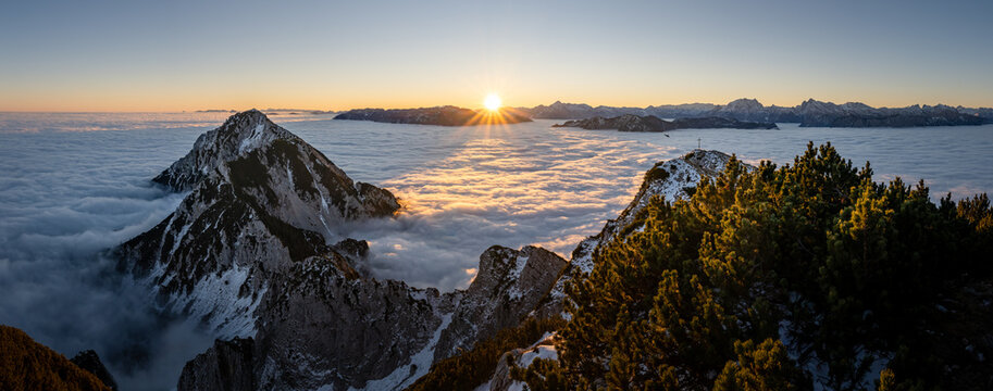 Berchtesgaden Alps at sunrise over a sea of clouds, Zwiesel summit cross, Bad Reichenhall, Bavaria, Germany