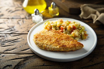 Homemade chicken schnitzel with rice and vegetables	