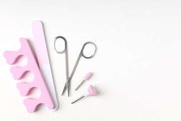 Concept of nail care with manicure accessories on white background