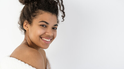 Young afro american woman smiling wide, looking at camera