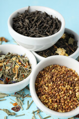 Concept of cooking tea with different types of tea on blue background