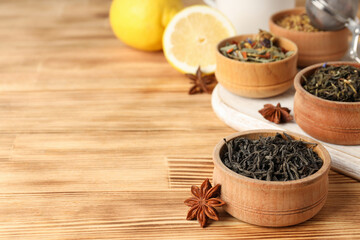 Concept of cooking tea with different types of tea on wooden background