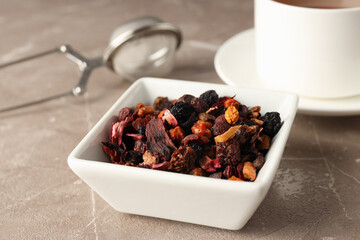 Concept of cooking tea with different types of tea on light textured background