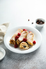 Homemade crepes with ricotta and raisins