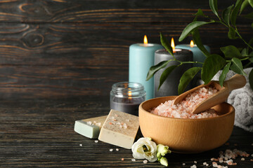 Spa accessories on dark wooden table, close up