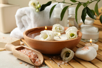 Spa accessories on white textured table, close up