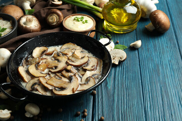 Concept of tasty food with mushroom sauce on wooden background