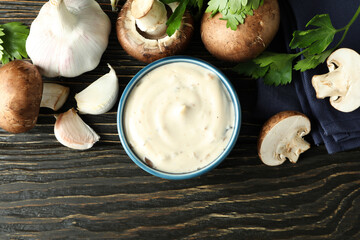 Concept of tasty food with mushroom sauce on wooden background