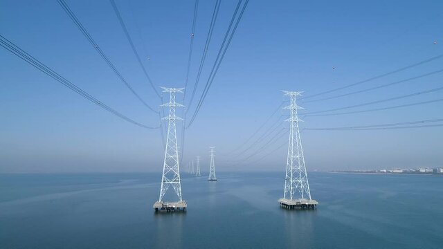 Aerial view of electric transmission tower above the sea, high voltage steel pylon, power, electric, energy, industry. 시화호, 철탑, 고압선, 송전탑.
