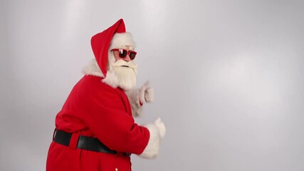 Santa claus in sunglasses runs on a white background. Merry Christmas.