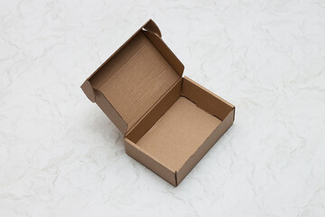 Small cardboard box for storing things on a white background.