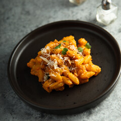 Pasta with red pesto and cheese