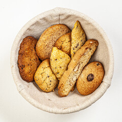 Hand made butter cookies in basket isolated on white background