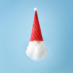 Santa Claus with a hat made of ice cream cone and cotton. New Year or Christmas holiday party