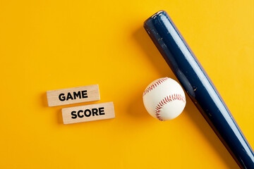 Baseball ball and bat on yellow background with the words game score