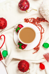 Christmas composition with coffee on white background. Holiday greeting card concept. Cozy winter composition