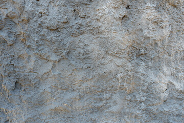 An empty multicolored background for use in advertising or design. An old concrete wall with cracks and traces of old paint. Place to insert text.