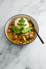 vegan thai green curry with rice and mixed vegetables, healthy plant-based food