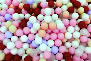 Multi-colored balls in the pool top view