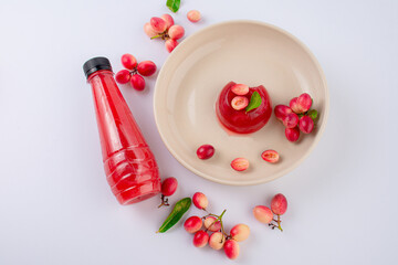 Jelly dessert with Fresh organic Carunda or Karonda fruits on white background
