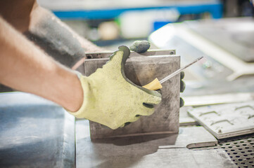 Worker technician work with soft PVC liquid rubber in mold