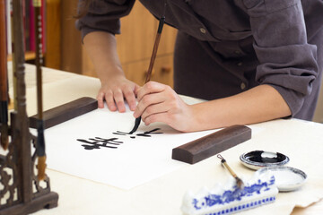 Traditional Chinese calligraphy Master writing character translation means Happiness. Asian art...