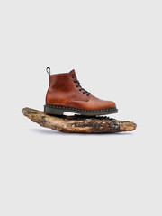 Photo of brown winter boots on a white background
