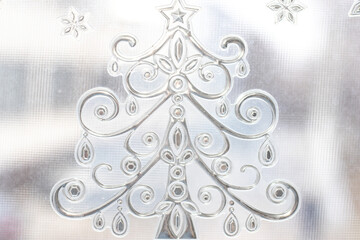 fir tree sticker on a dirty window glass. christmas mood, winter time. holidays.