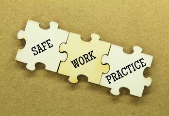 Wooden puzzles with the word safe work practice - obrazy, fototapety, plakaty