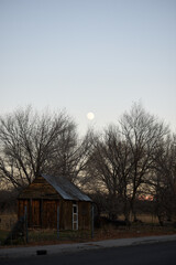 Abandoned shack with a desert sunset