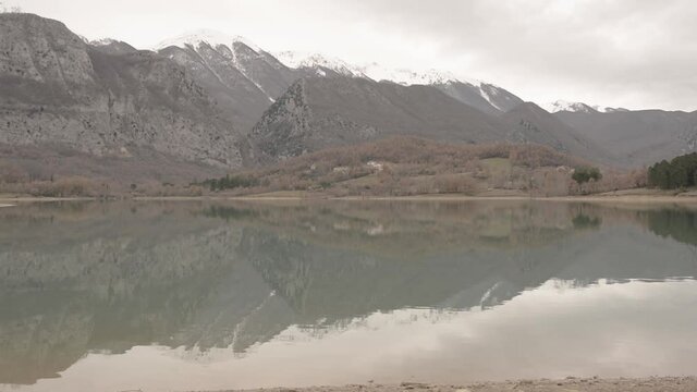 landscape with lake and mountains, Castel San Vincenzo, Molise Italy, slog video
