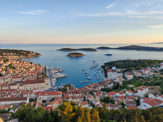 Streets of historic and tourist town of Hvar with fort, port and yacht marine, Croatian island otok...