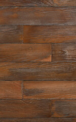 Obraz premium Beautiful wall of dark brown wooden planks, vertical image, texture and background.