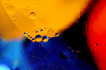 Abstract colorful background of oil circles. Oil in circles on the water surface, water foam and...