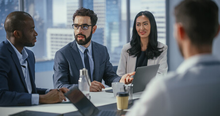 Modern Multi-Ethnic Office Conference Room Meeting: Diverse Team of Top Managers Talk, Brainstorm,...