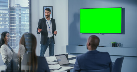 Office Conference Room Meeting Presentation: Handsome Businessman Talks, Uses Green Screen Chroma...