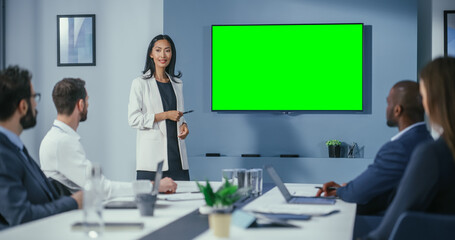 Office Conference Room Meeting Presentation: Motivated Businesswoman Talks, Uses Green Screen...