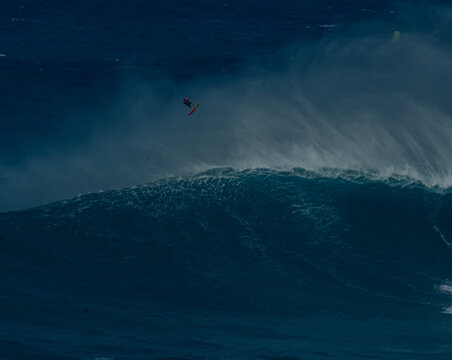 Sport photography. Jaws swell on International surfing event in Maui, Hawai 2021 December.