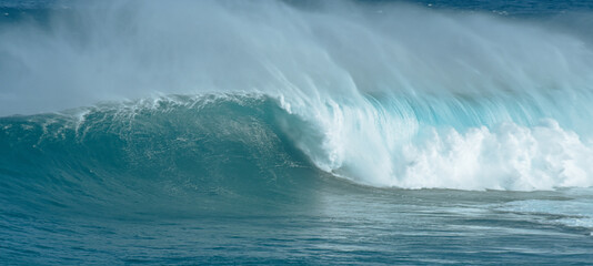 Sport photography. Jaws swell on International surfing event in Maui, Hawai 2021 December.