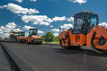 Laying a new asphalt on the road. Construction of the road.