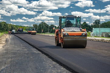 Laying a new asphalt on the road. Construction of the road.